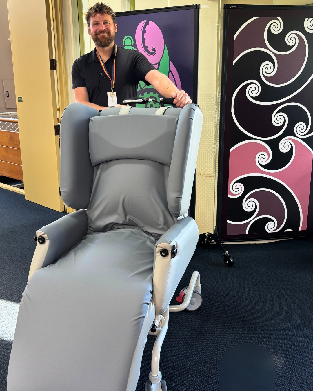 Mary Potter Hospice physiotherapist Brian holding specialised care equipment